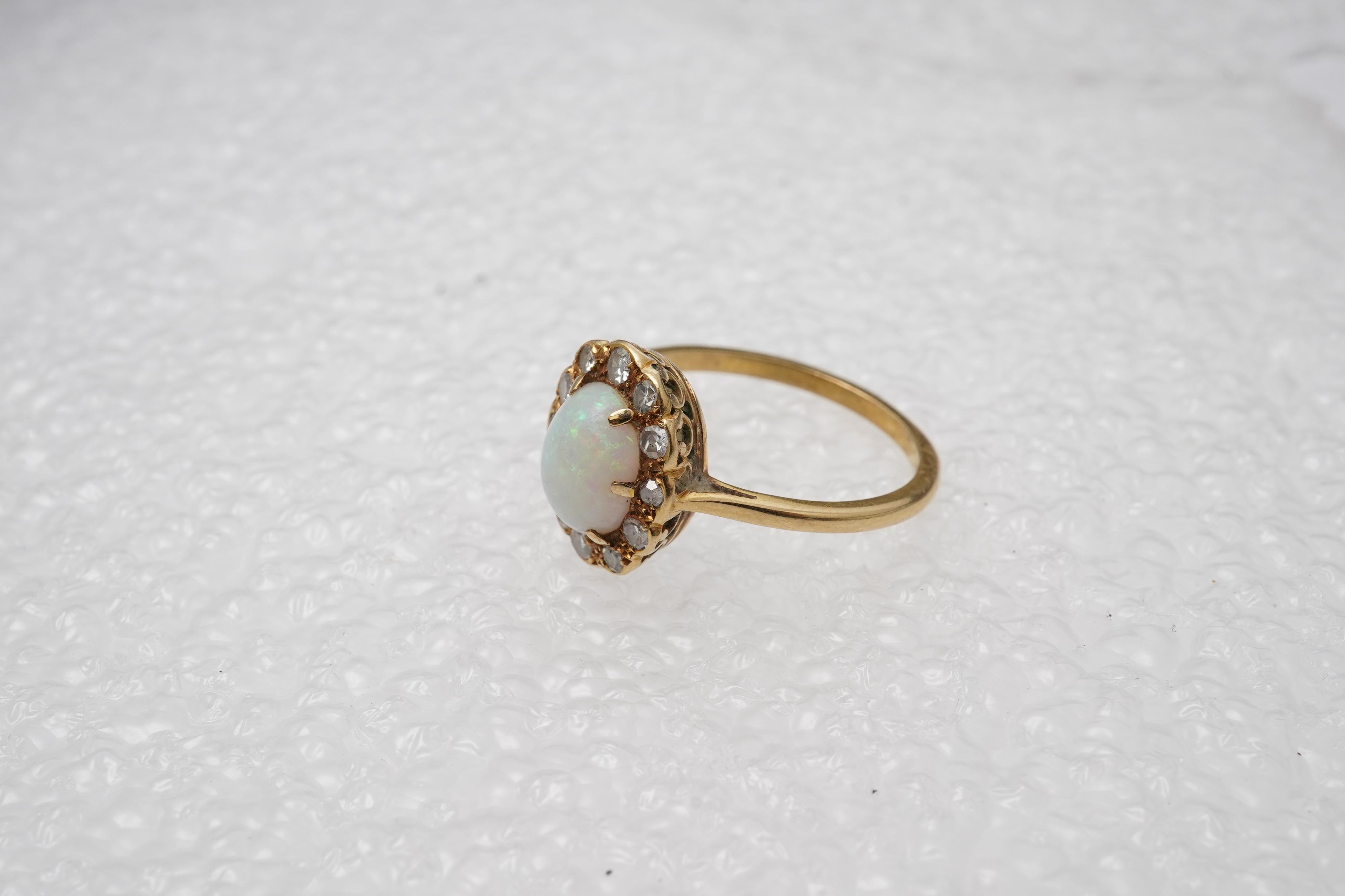 An opal and diamond cluster ring, mid 20th century